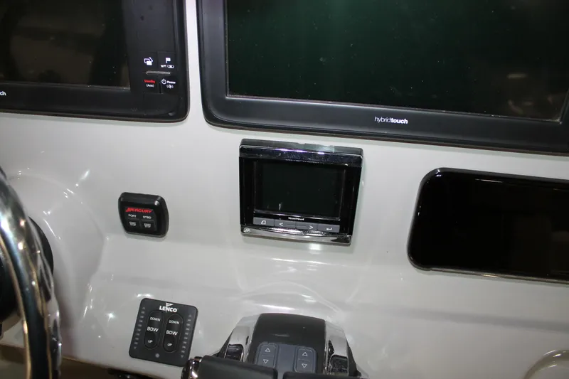 Slide: The Image of Control panel of 2017 Boston Whaler 330 Outrage with navigation and control systems. - 45