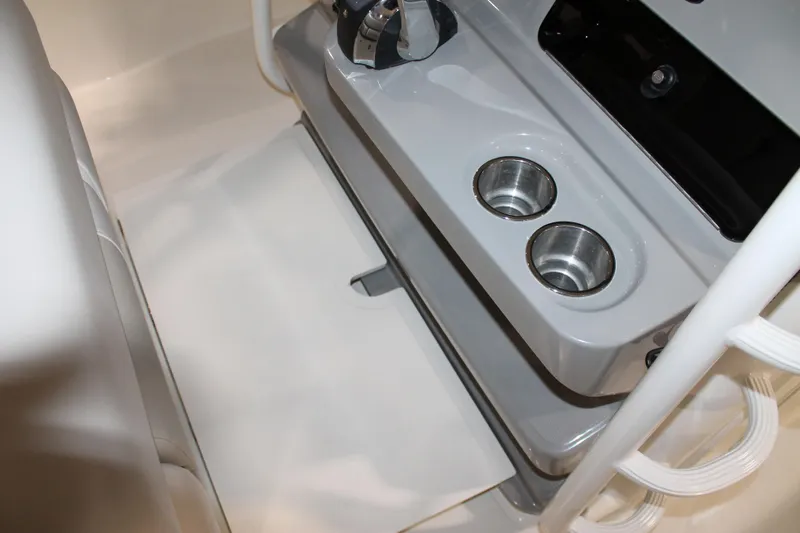 Slide: The Image of 2017 Boston Whaler 330 Outrage interior with dual cup holders and sleek design. - 49