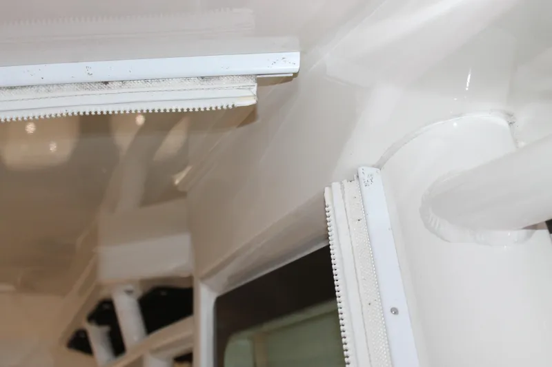 Slide: The Image of Close-up of 2017 Boston Whaler 330 Outrage interior detailing, showcasing white structural elements. - 50