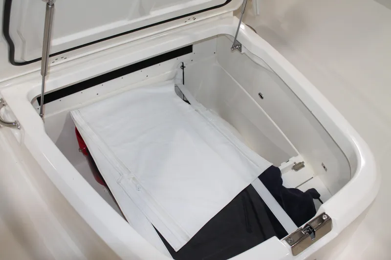 Slide: The Image of Storage compartment of 2017 Boston Whaler 330 Outrage boat, open with cover inside. - 63