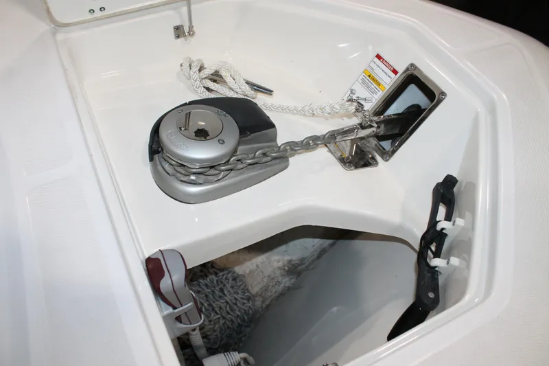 Slide: The Image of 2017 Boston Whaler 330 Outrage anchor chain and windlass system in boat compartment. - 65