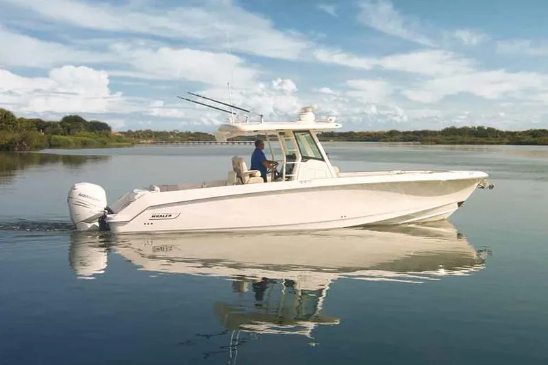 Slide: The Image of Manufacturer Provided Image: 2017 Boston Whaler 330 Outrage boat cruising on calm water. - 77