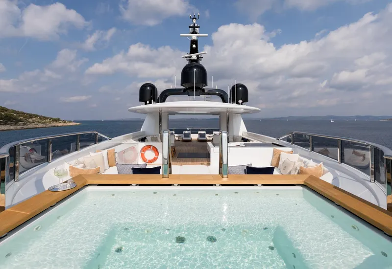 Slide: The Image of Luxurious Alia Yachts 60M (2016) with pool, ocean view, and elegant deck seating. - 22