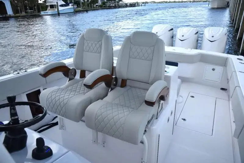 Slide: The Image of Manufacturer Provided Image: Luxury seating on 2026 Jupiter 380LS boat, featuring elegant design and waterfront view. - 2