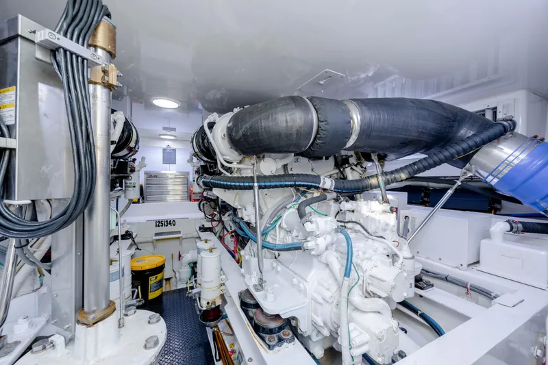 Slide: The Image of Engine room of 2009 Viking 60 Convertible yacht, showcasing complex machinery and components. - 101