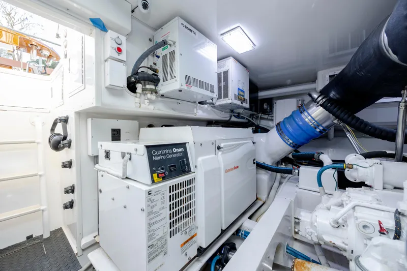 Slide: The Image of Engine room of 2009 Viking 60 Convertible with Cummins Onan marine generator. - 103