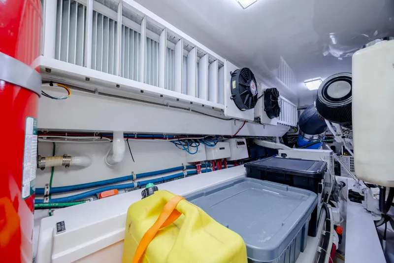 Slide: The Image of Engine room of 2009 Viking 60 Convertible yacht with storage containers and equipment. - 110