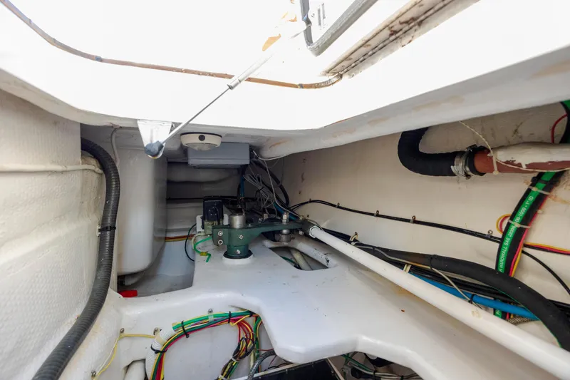 Slide: The Image of Engine compartment of 2009 Viking 60 Convertible yacht, showcasing wiring and mechanical components. - 114