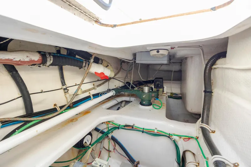 Slide: The Image of Engine room of 2009 Viking 60 Convertible yacht, showcasing wiring and mechanical components. - 115