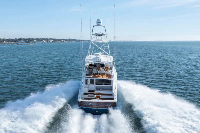 Slide: The Image of 2009 Viking 60 Convertible yacht cruising on open water, rear view. - 17
