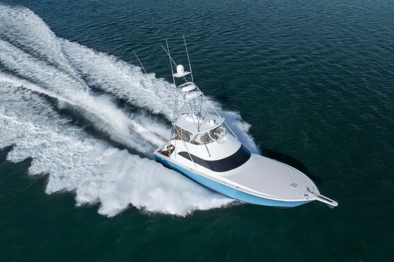 Slide: The Image of 2009 Viking 60 Convertible yacht cruising swiftly on open water. - 22