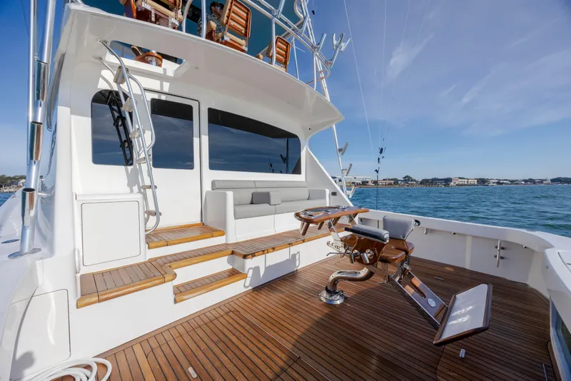 Slide: The Image of 2009 Viking 60 Convertible yacht with teak deck and fishing chair on open sea. - 30