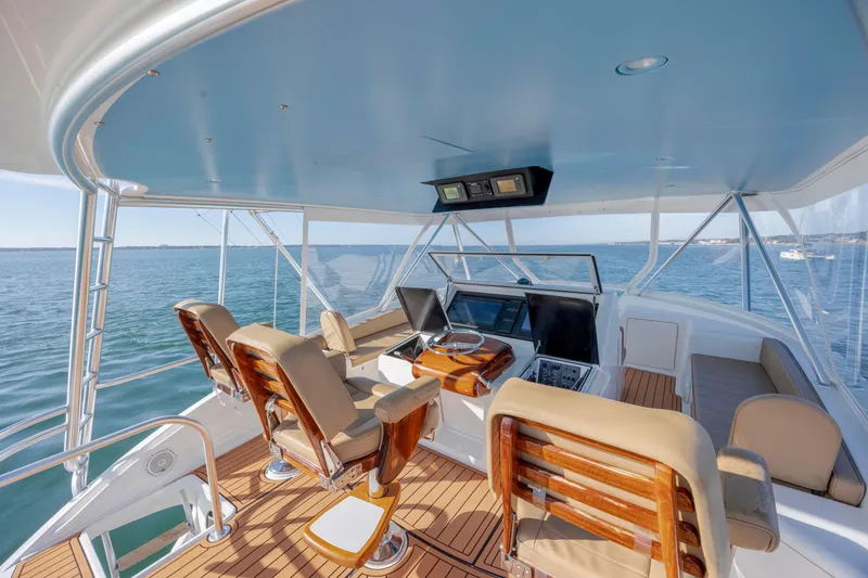 Slide: The Image of 2009 Viking 60 Convertible yacht helm with ocean view and luxurious seating. - 46