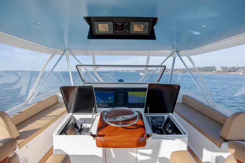 Slide: The Image of 2009 Viking 60 Convertible yacht helm with navigation screens and ocean view. - 47