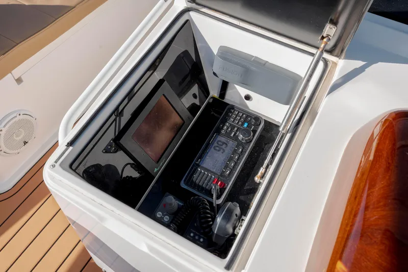 Slide: The Image of Control panel on 2009 Viking 60 Convertible yacht, featuring navigation and communication equipment. - 50