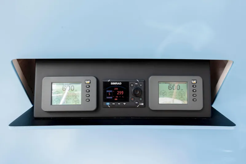 Slide: The Image of Control panel of 2009 Viking 60 Convertible yacht with Simrad and CAT displays. - 53