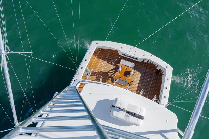 Slide: The Image of Aerial view of 2009 Viking 60 Convertible yacht deck over green water. - 61