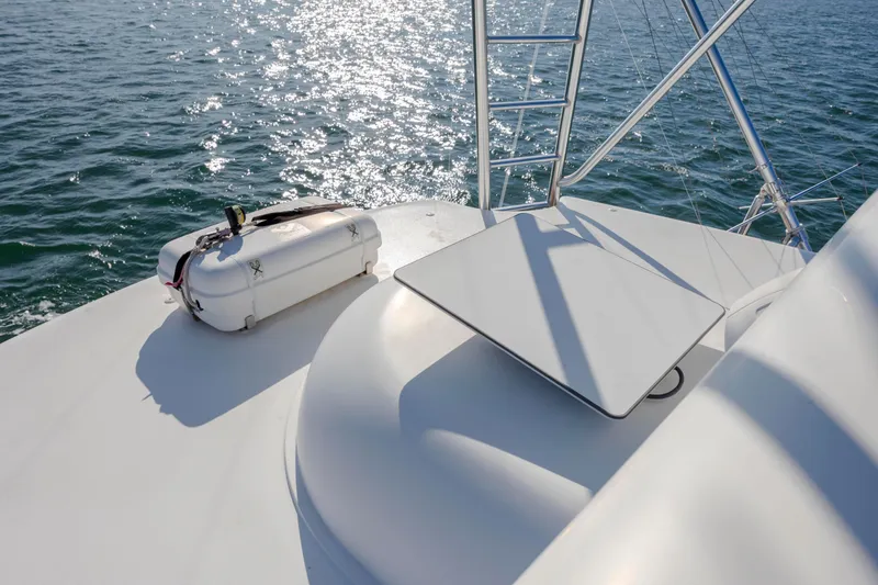 Slide: The Image of 2009 Viking 60 Convertible yacht deck with life raft and ocean view. - 63