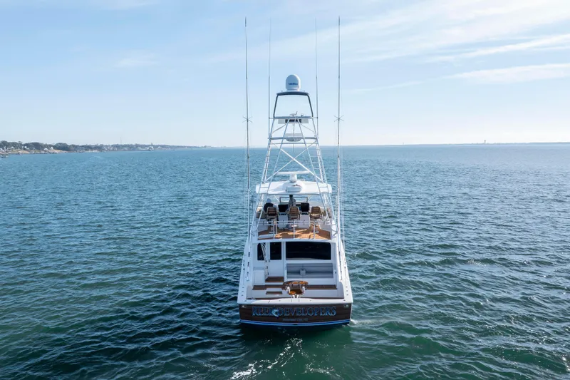 Slide: The Image of 2009 Viking 60 Convertible yacht on open water, rear view. - 7