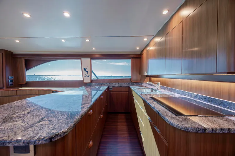Slide: The Image of Luxurious kitchen interior of 2009 Viking 60 Convertible yacht with granite countertops and ocean view. - 73