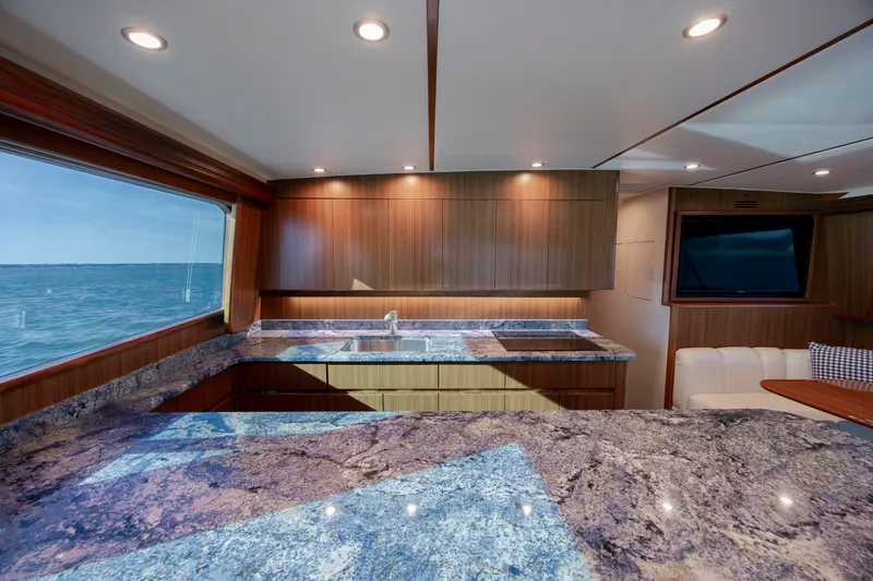 Slide: The Image of Luxurious interior of 2009 Viking 60 Convertible yacht with granite countertops and ocean view. - 74