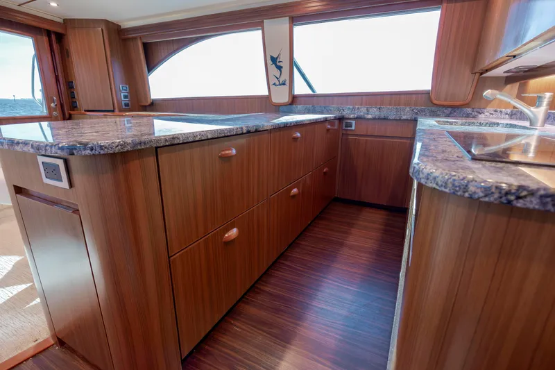 Slide: The Image of Luxurious wooden interior of 2009 Viking 60 Convertible yacht kitchen with granite countertops. - 77