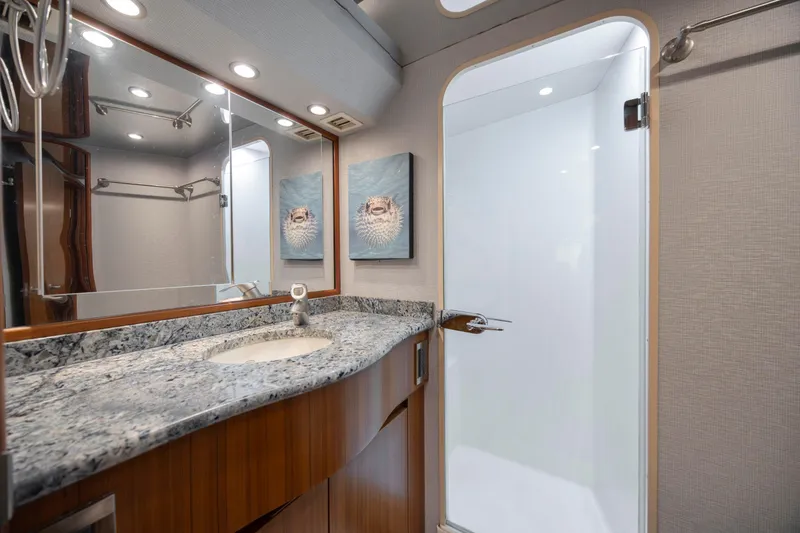 Slide: The Image of Luxurious bathroom in 2009 Viking 60 Convertible yacht with granite countertop and modern fixtures. - 88