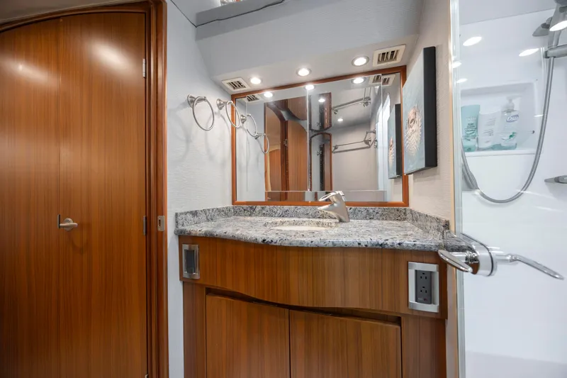 Slide: The Image of Luxurious bathroom in 2009 Viking 60 Convertible yacht with granite countertop and modern fixtures. - 89
