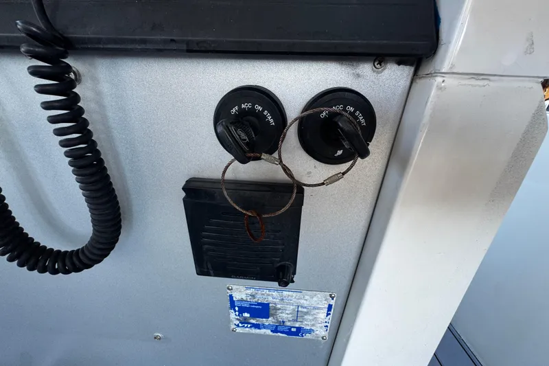 Slide: The Image of Control panel of a 2017 Axopar 37 Sun Top boat with ignition switches. - 20