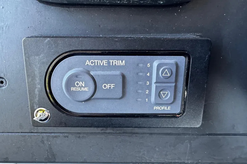 Slide: The Image of Active trim control panel on 2017 Axopar 37 Sun Top boat dashboard. - 28