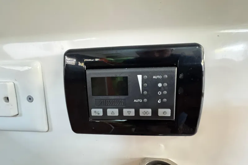 Slide: The Image of Control panel on 2017 Axopar 37 Sun Top boat, featuring various function buttons. - 32