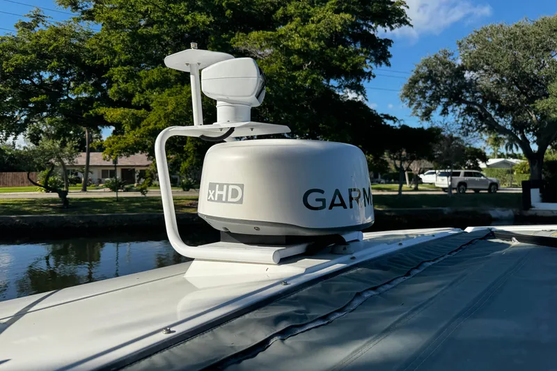 Slide: The Image of Garmin xHD radar on 2017 Axopar 37 Sun Top boat, docked near trees. - 40