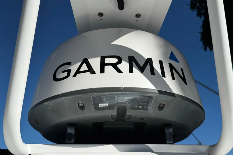 Slide: The Image of Garmin radar on 2017 Axopar 37 Sun Top boat against clear blue sky. - 41
