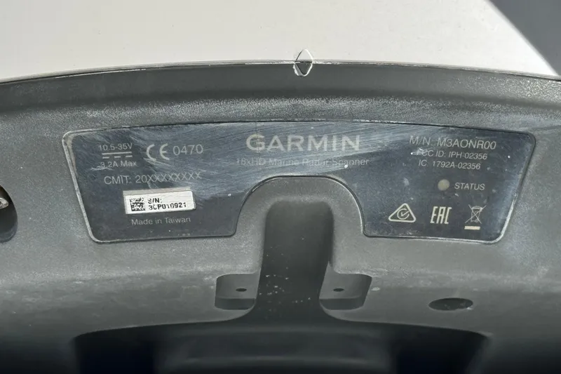 Slide: The Image of Garmin device label on 2017 Axopar 37 Sun Top, showing model and serial information. - 42