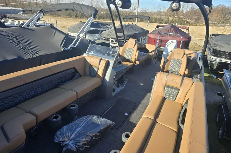 Slide: The Image of 2026 Qwest 8524 Q3XA pontoon boat interior with tan seating and modern design. - 10