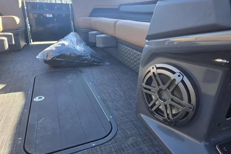 Slide: The Image of Interior of 2026 Qwest 8524 Q3XA boat with speaker and seating. - 13