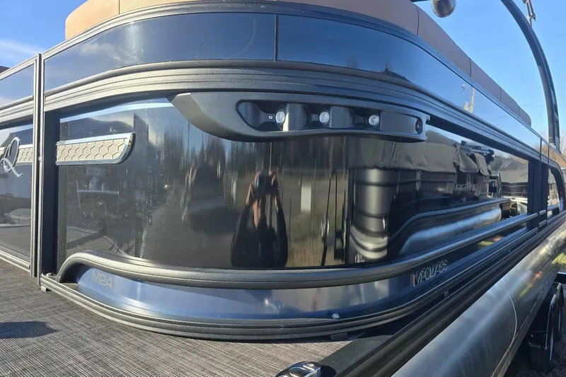 Slide: The Image of 2026 Qwest 8524 Q3XA pontoon boat with sleek black exterior design. - 5