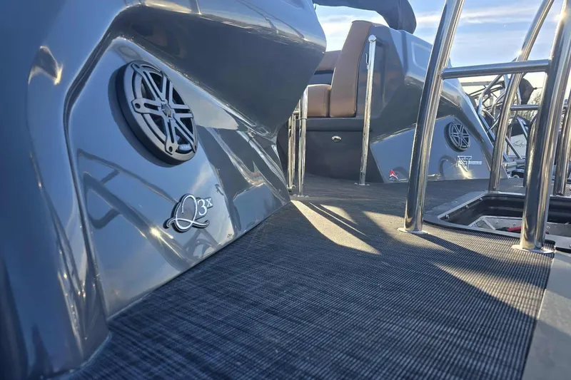 Slide: The Image of 2026 Qwest 8524 Q3XA boat interior with sleek design and modern speaker system. - 6