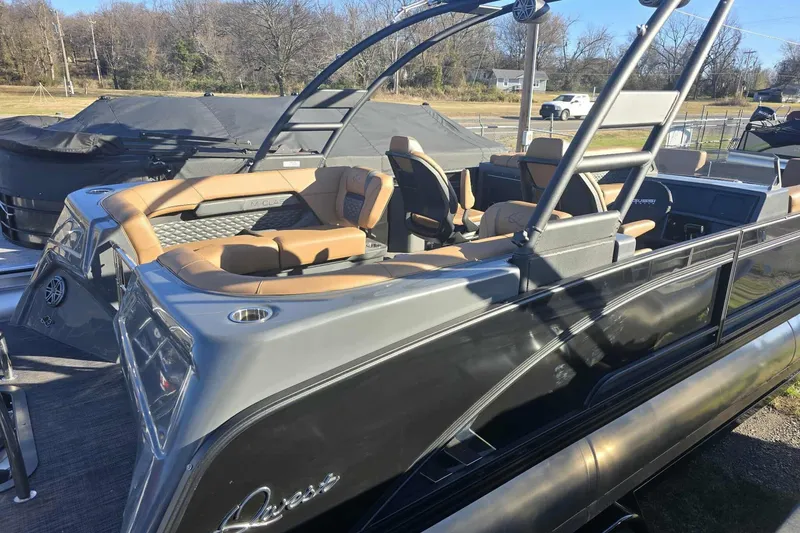 Slide: The Image of 2026 Qwest 8524 Q3XA pontoon boat with luxurious seating and sleek design. - 9