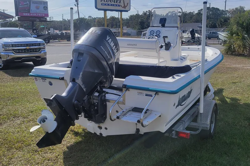 Slide: The Image of 2011 Sundance SV186 boat with Yamaha motor on trailer, parked outdoors. - 7