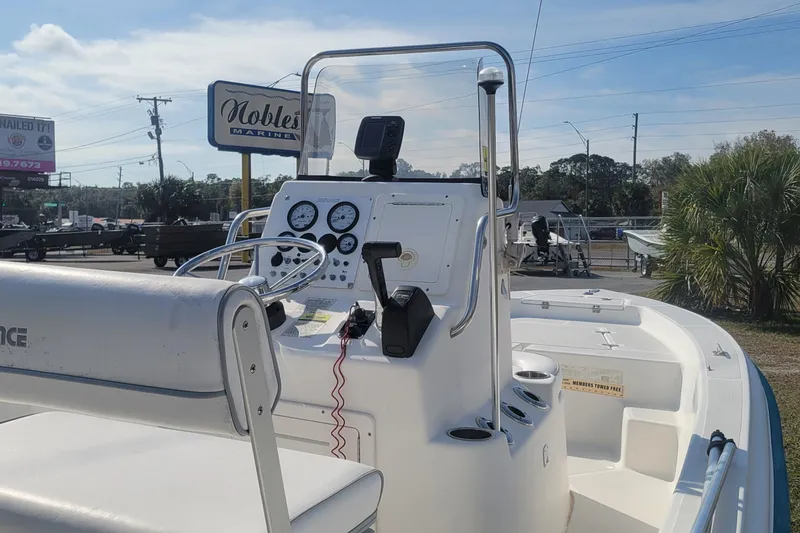 Slide: The Image of 2011 Sundance SV186 boat dashboard with steering wheel and gauges at Noble's Marine. - 8