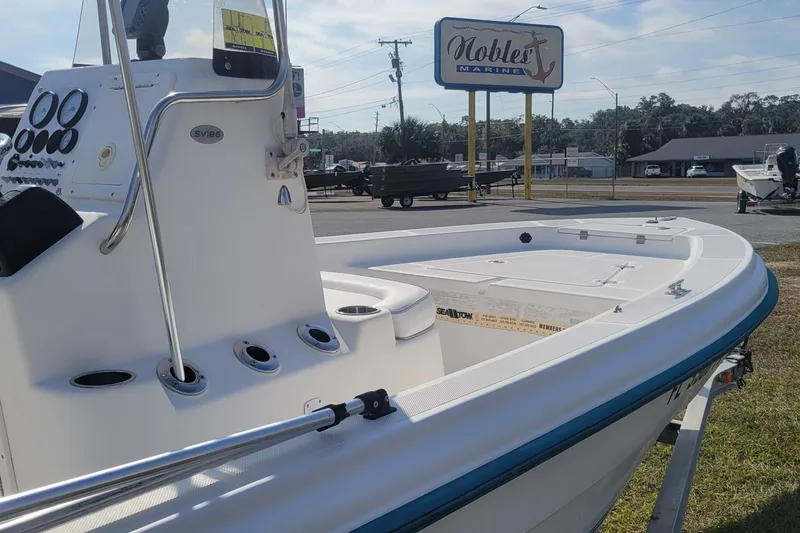 Slide: The Image of 2011 Sundance SV186 boat at Nobles Marine dealership, showcasing console and deck features. - 9