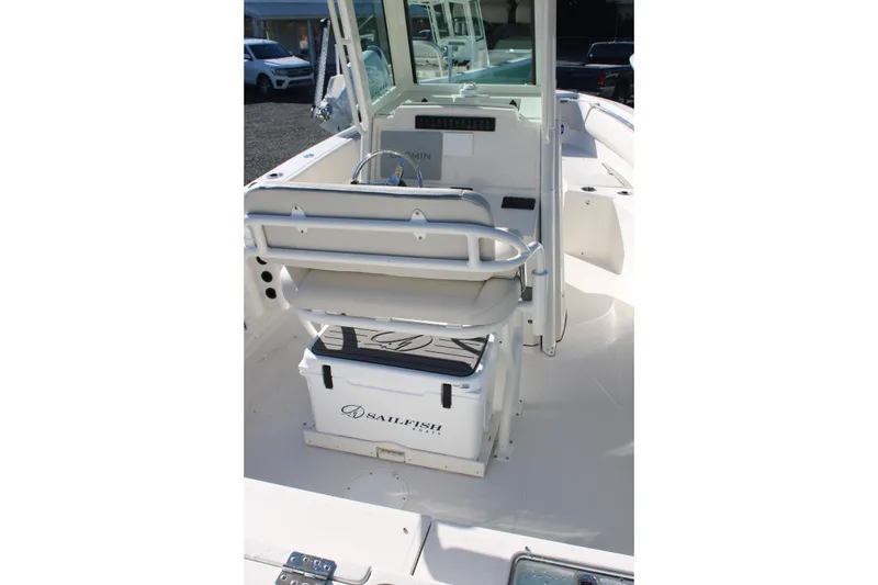 Slide: The Image of 2026 Sailfish 232 CC boat interior with seating and storage. - 19