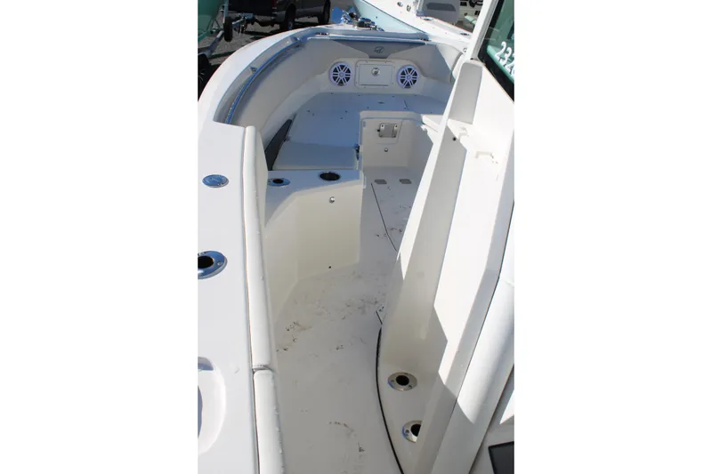 Slide: The Image of 2026 Sailfish 232 CC boat interior with seating and storage compartments. - 23