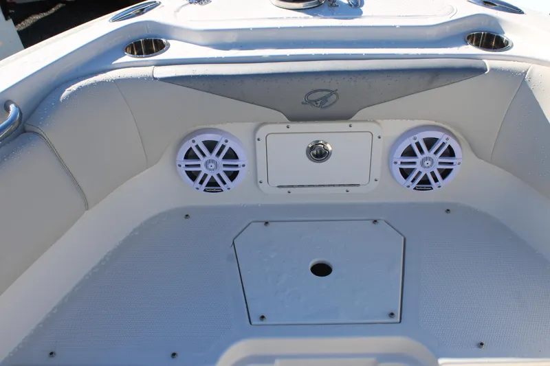 Slide: The Image of Interior of 2026 Sailfish 232 CC boat featuring speakers and storage compartment. - 27