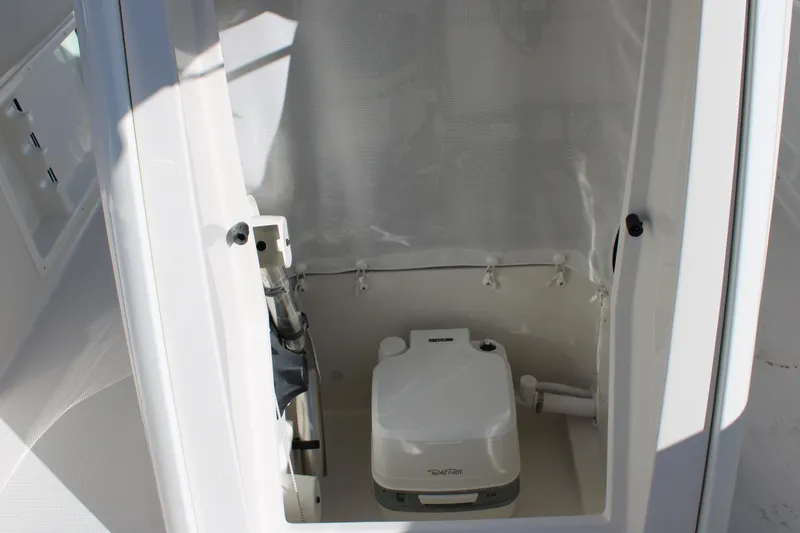 Slide: The Image of Portable toilet inside 2026 Sailfish 232 CC boat cabin. - 28