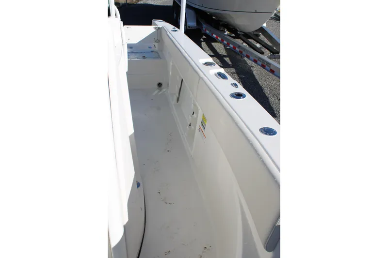 Slide: The Image of 2026 Sailfish 232 CC boat interior with rod holders and clean deck design. - 31