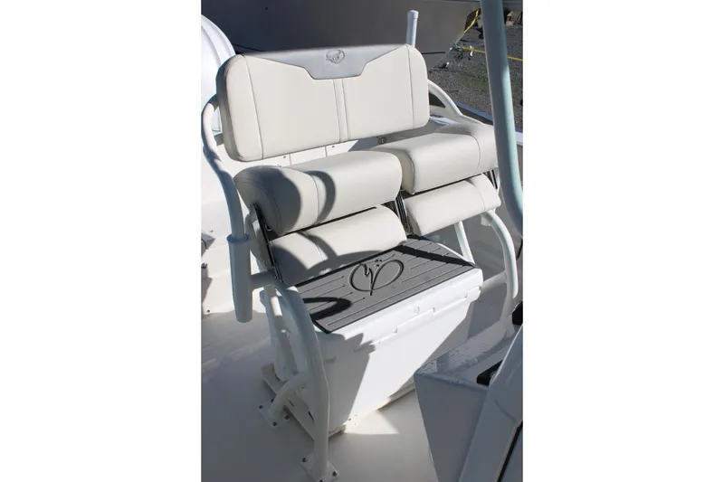Slide: The Image of 2026 Sailfish 232 CC boat seating with cushioned backrest and armrests. - 33