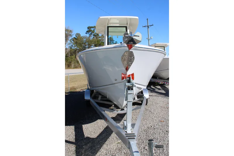Slide: The Image of 2026 Sailfish 232 CC boat on trailer, front view, outdoors. - 39