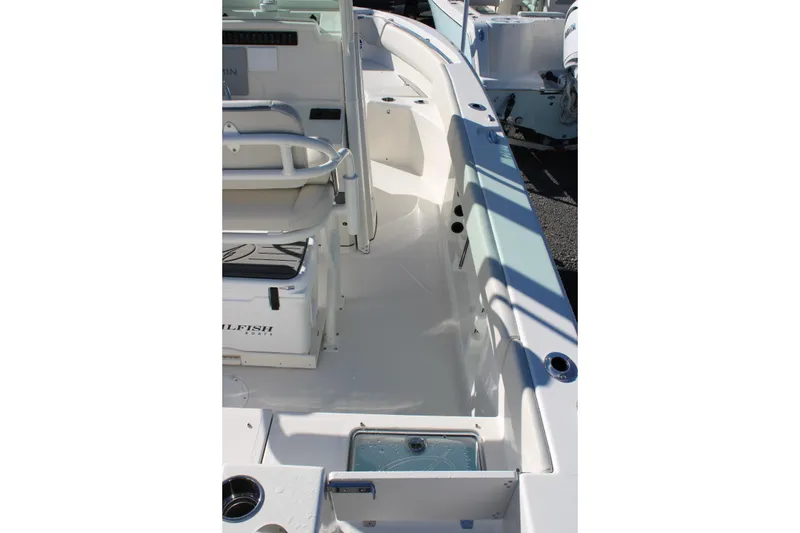 Slide: The Image of 2026 Sailfish 232 CC boat interior with seating and storage compartments. - 7